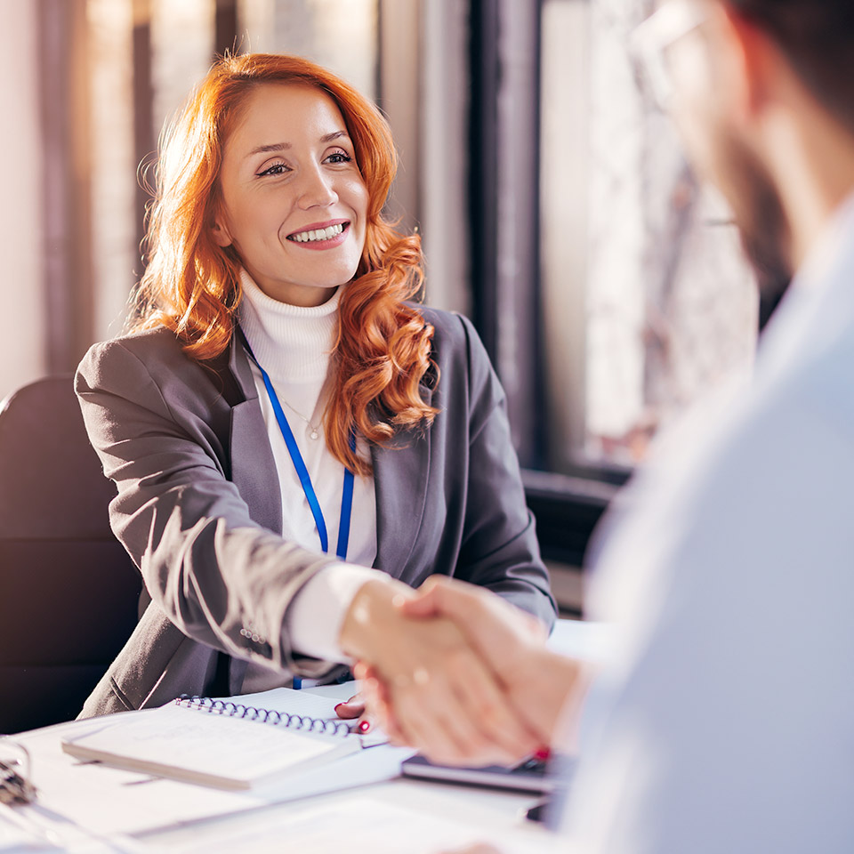 Agent shaking hands with customer